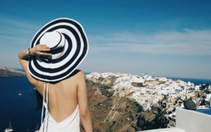 A woman adriring the view in Santorini