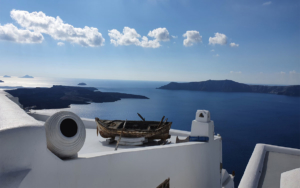 Boat on house roof in Santorini