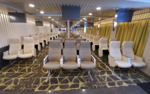 Numbered seating lounge with airplane seating.