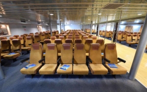 Numbered seating lounge with airplane seating.