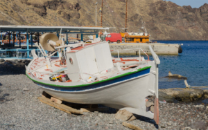 The small fishing boat near the beach